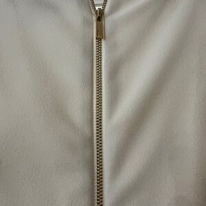 DKNY white flutter sleeve dress with gold zipper detail